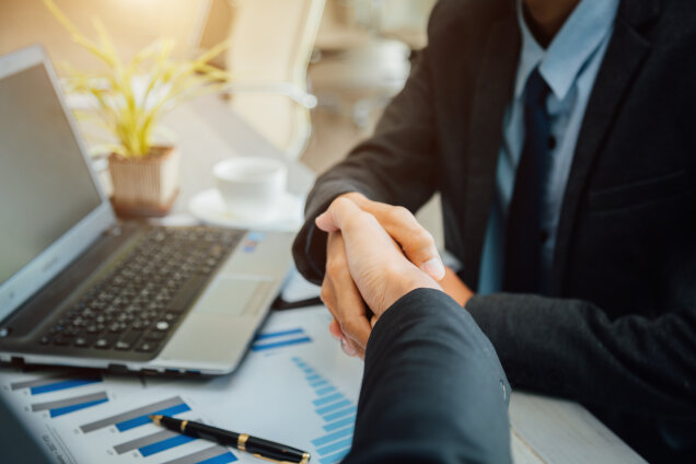 Business people shaking hands partner successful team leader and business meeting.